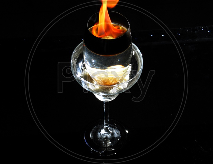 Glass with fire flames