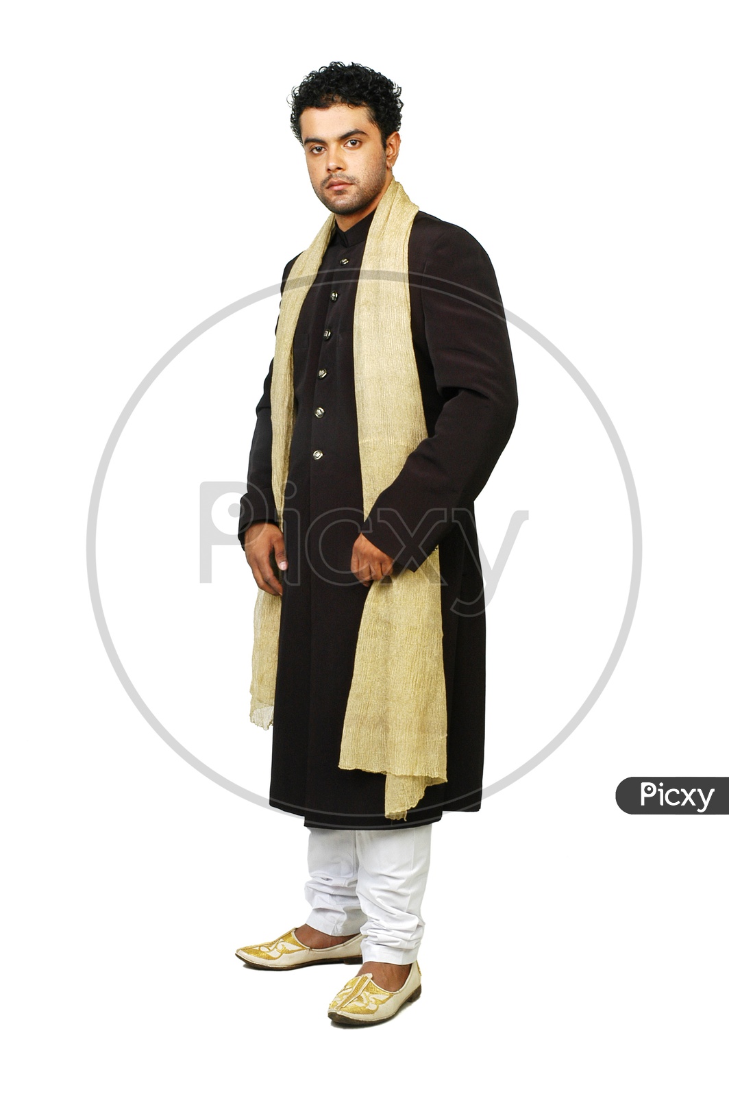 Image of Indian Man Wearing Traditional Wear and Showing  Space-UH778378-Picxy