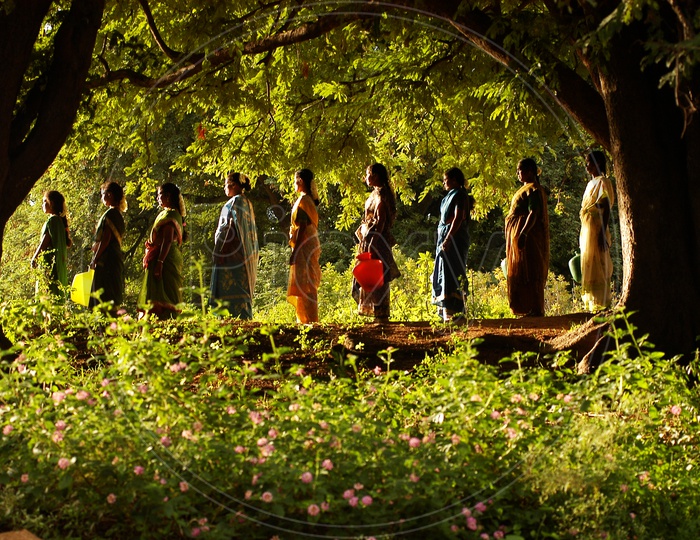 Indian rural women waiting to carry water in a queue