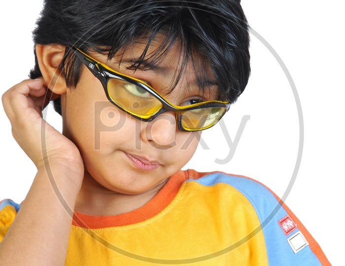 An Indian boy with specs dancing in white background