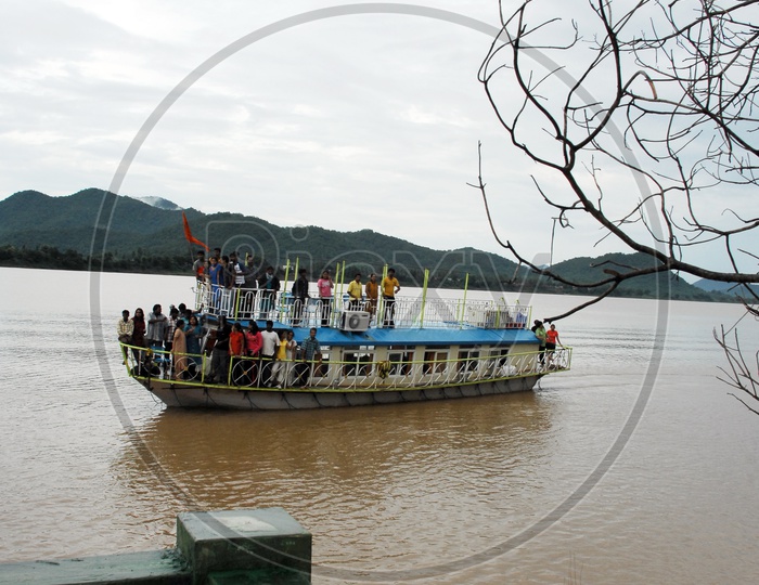 Tourists in the cruise boat moving on the River Godavari