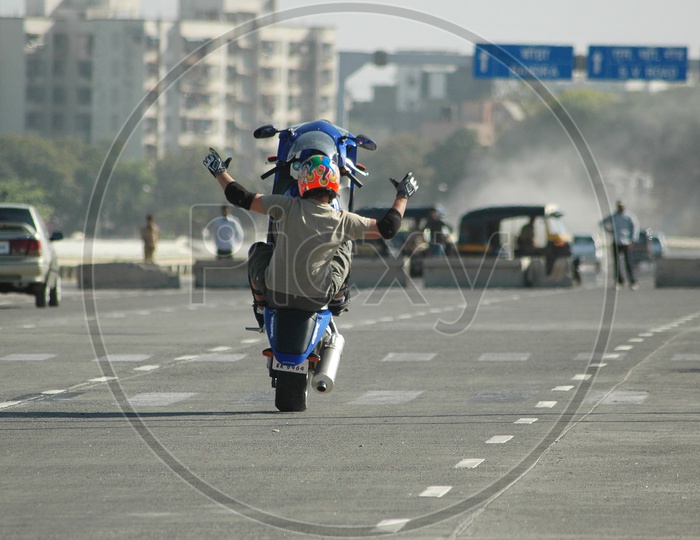 Motorcycle rider performing stunt