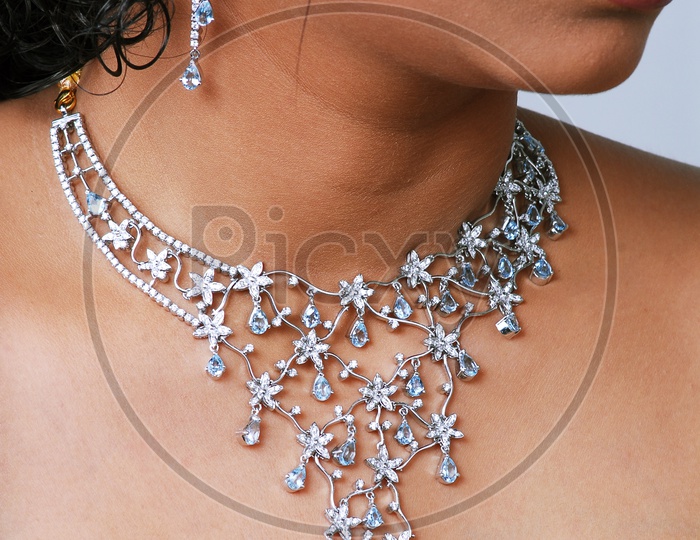 Close up shot of necklace on women's neck