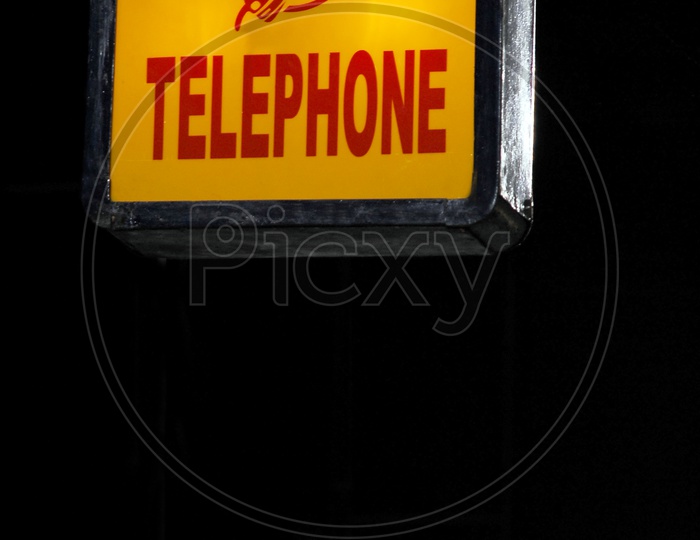 Sign board of a telephone booth