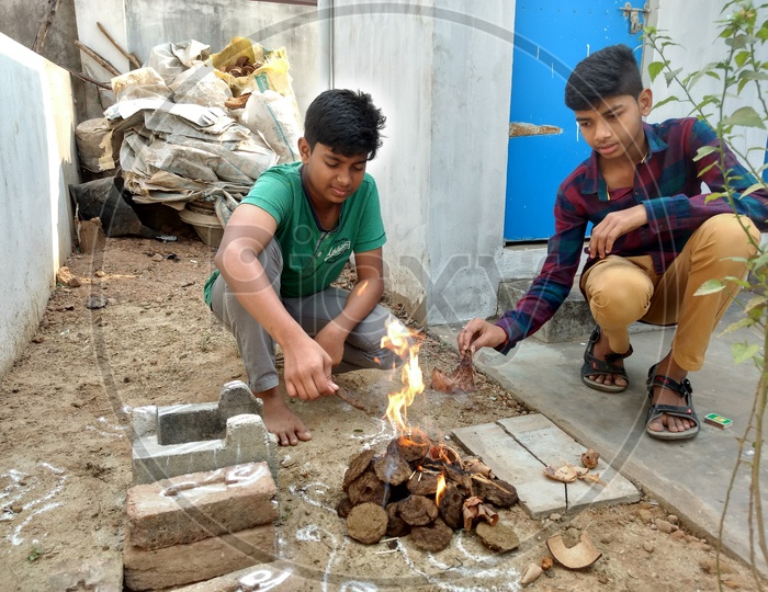 Children doing their rituals on the day of Bhogi festival