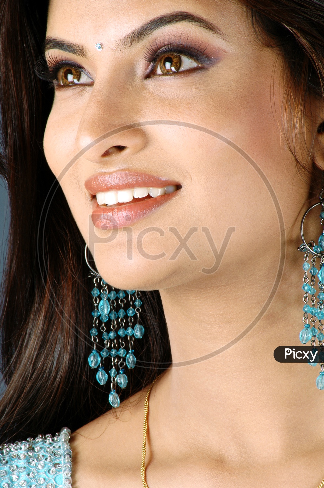 Indian Woman smiling wearing lipstick