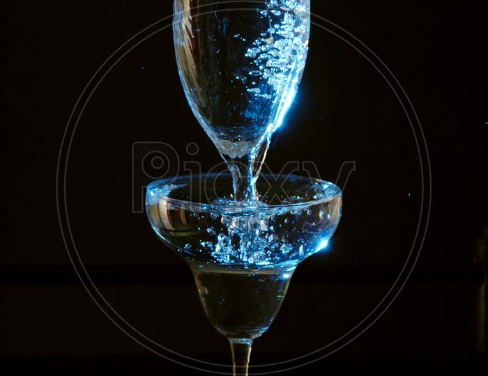 Water being poured in the wine glass
