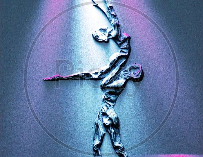 Carving of a couple dancing with disco lights