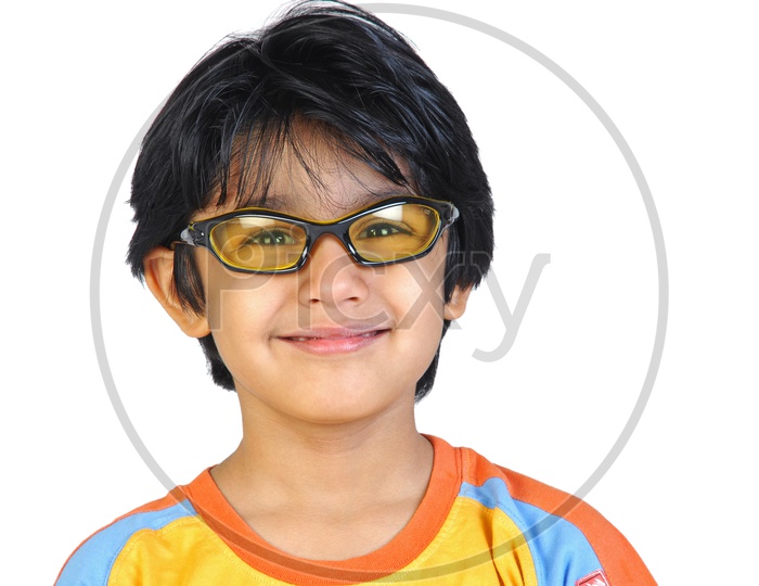 An Indian boy with specs smiling in white background
