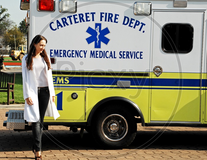 A Female Doctor beside the ambulance