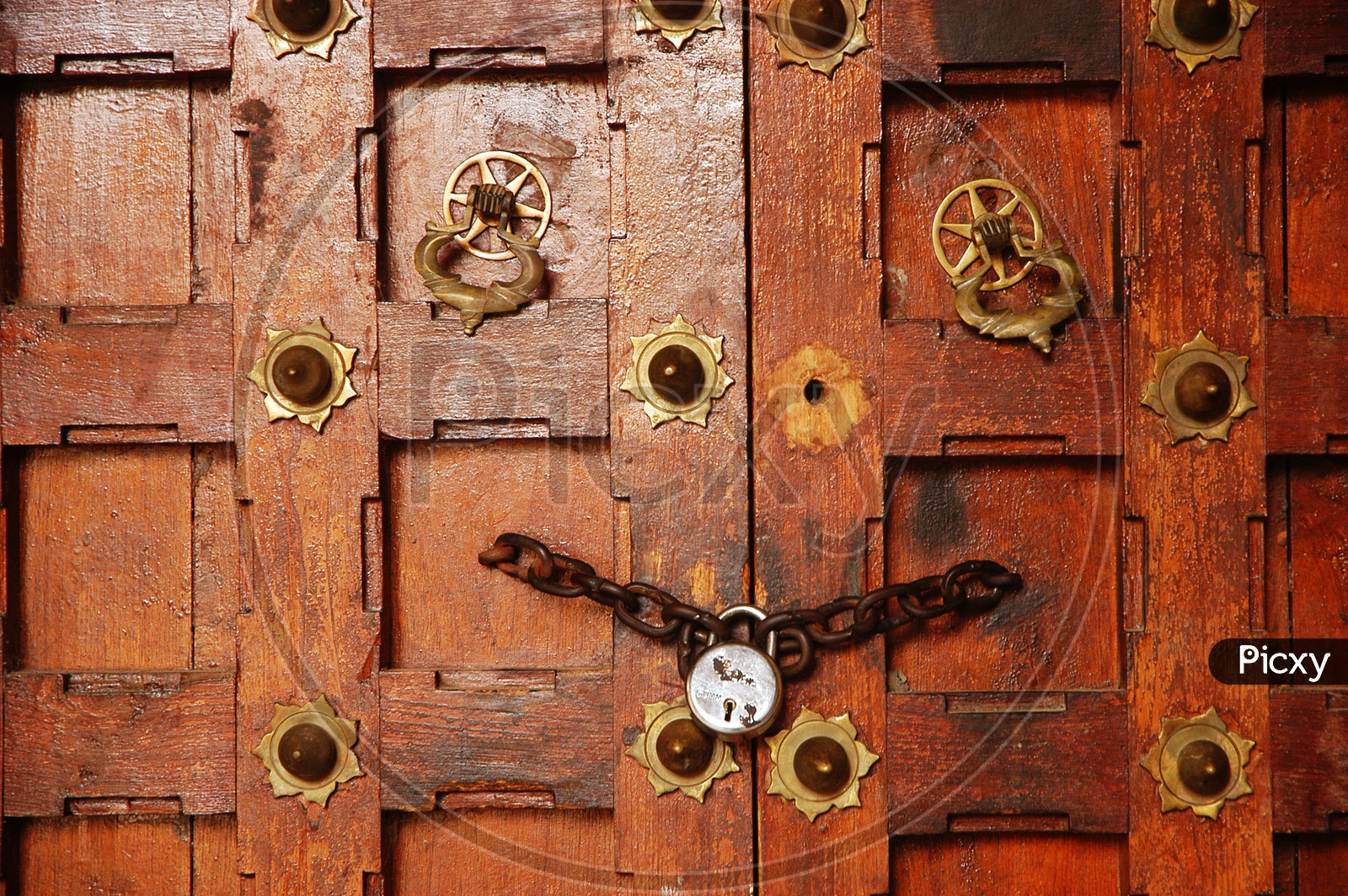 Wooden door locked with a chain
