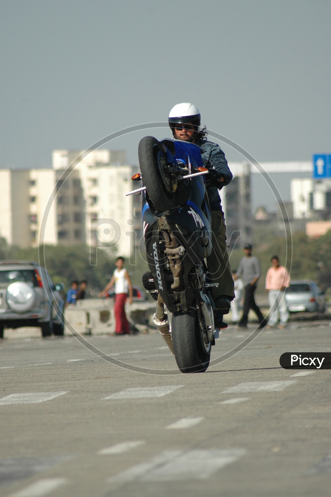 Image of Motorcycle rider performing stunt-VY793388-Picxy