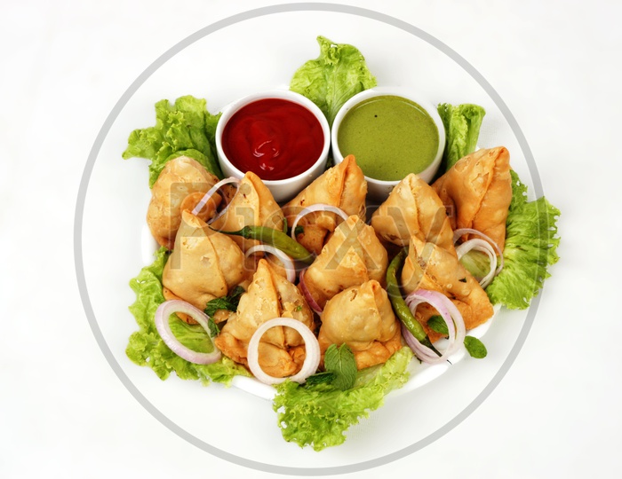 Samosa with green and red chutney