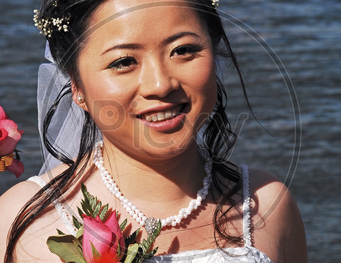 A woman wearing bridal costume