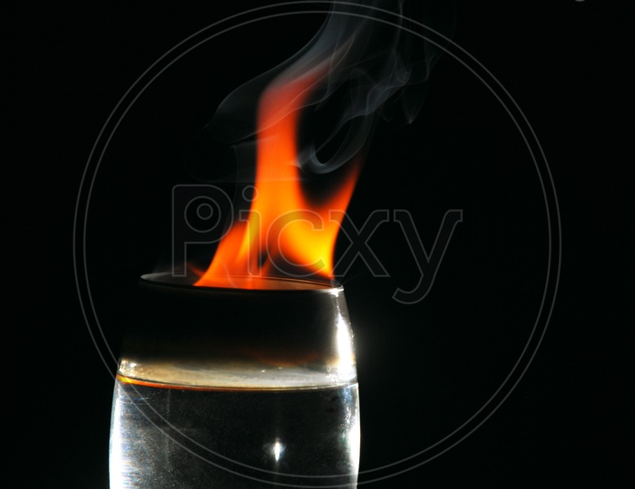 Glass with fire flames