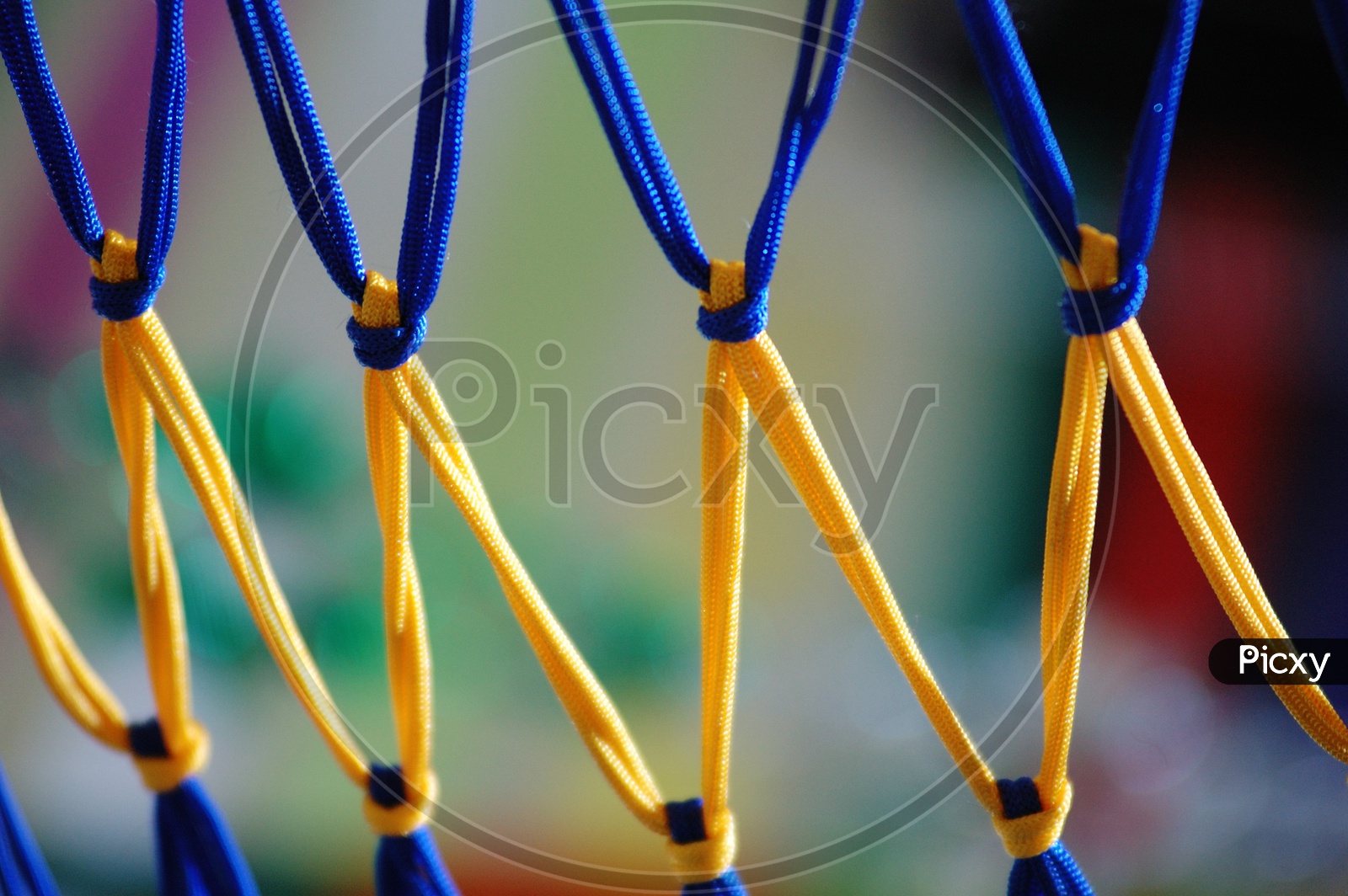 Yellow and blue threads tied in  a pattern