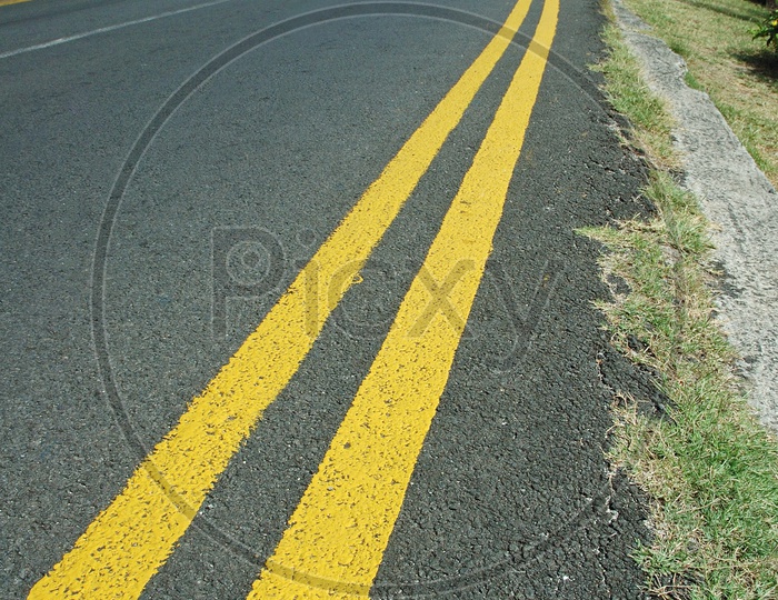Yellow pavement marking on the road