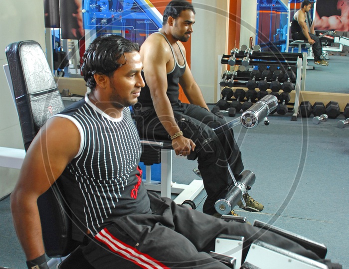 Indian men exercising in the gym