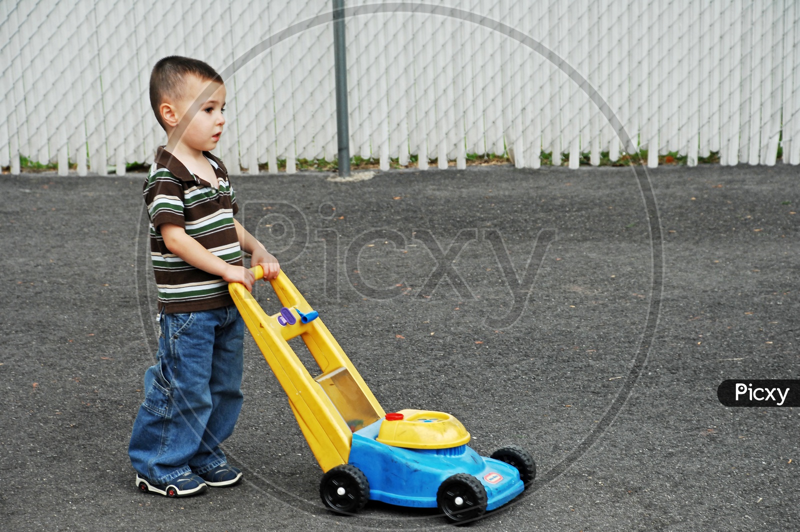 A Young Boy Playing With A Trolly Toy