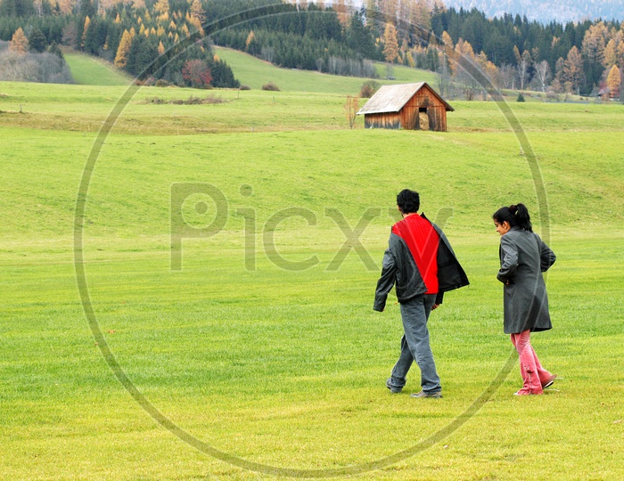 Couple walking in the meadows