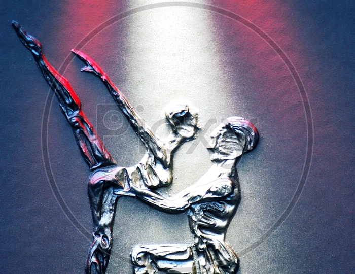 Carving of a couple dancing with disco lights