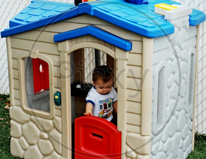 Toddler in a Playhouse