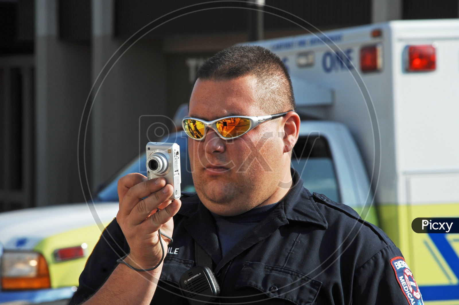 A medical security service man clicking pictures with a camera