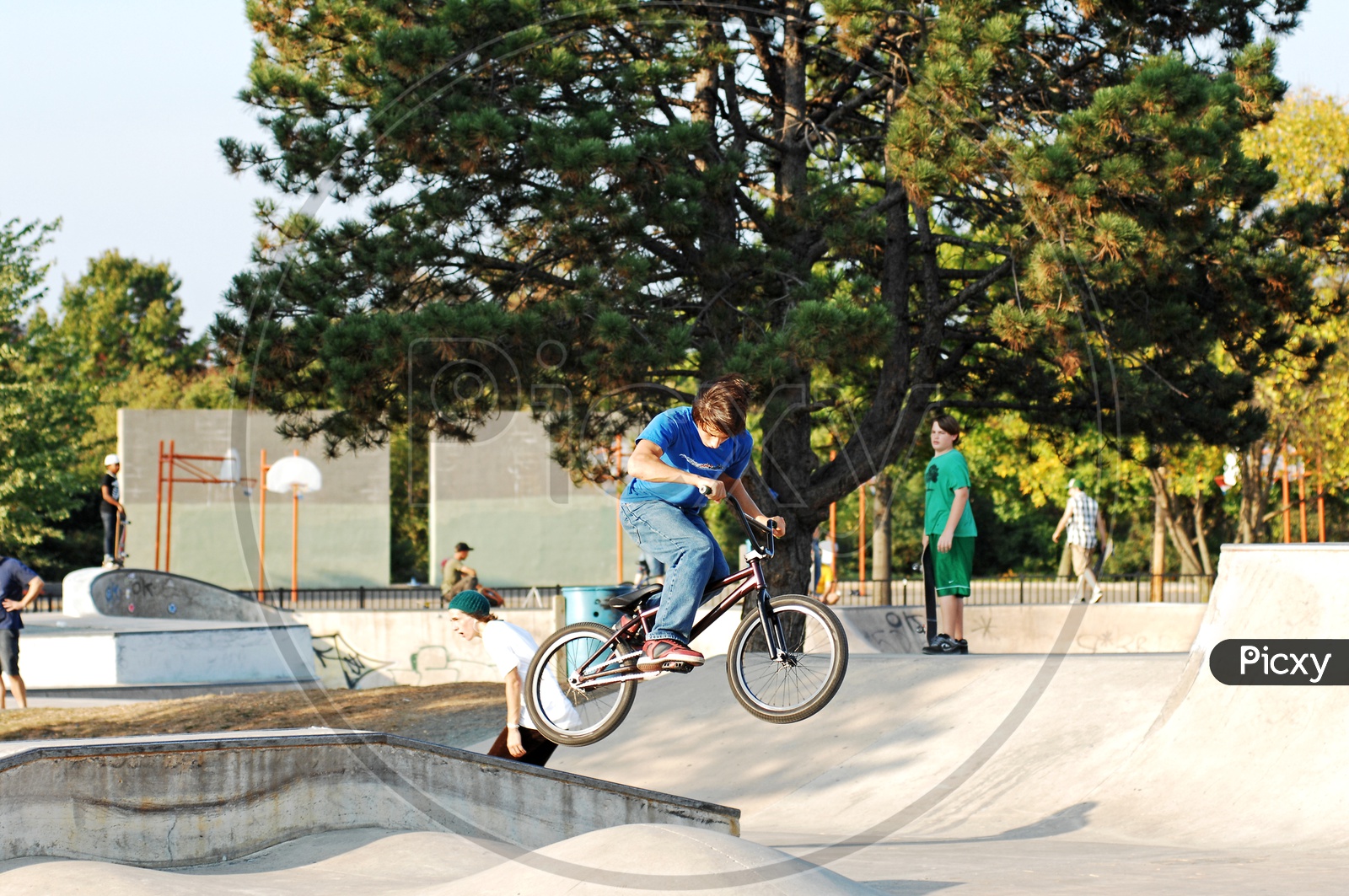 A young boy performing BMX