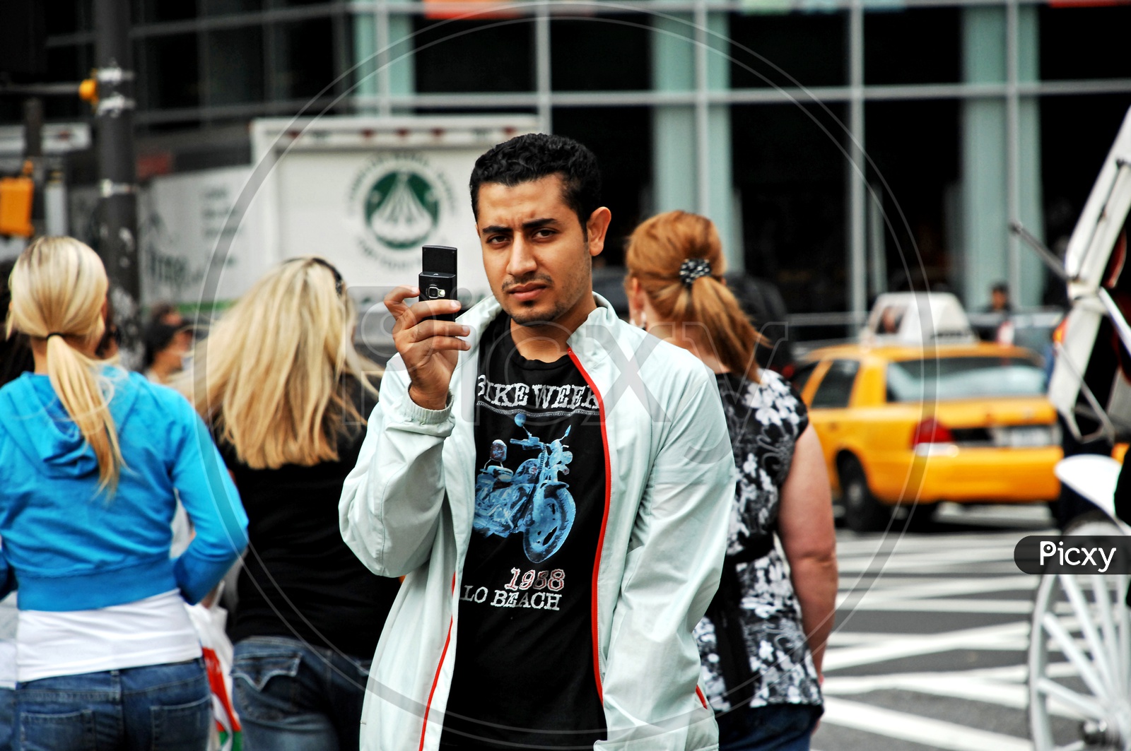 An Indian Man with a slider phone