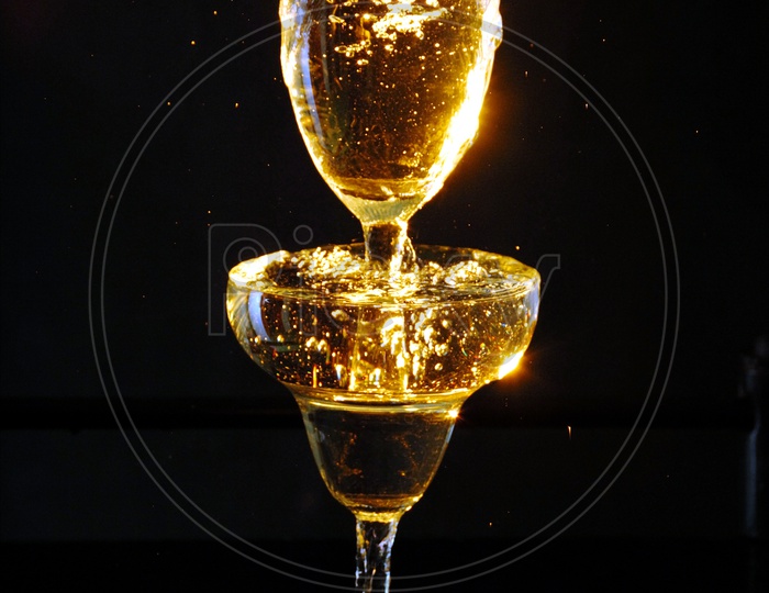 Wine Glass Closeup With Wine Pouring into Glass