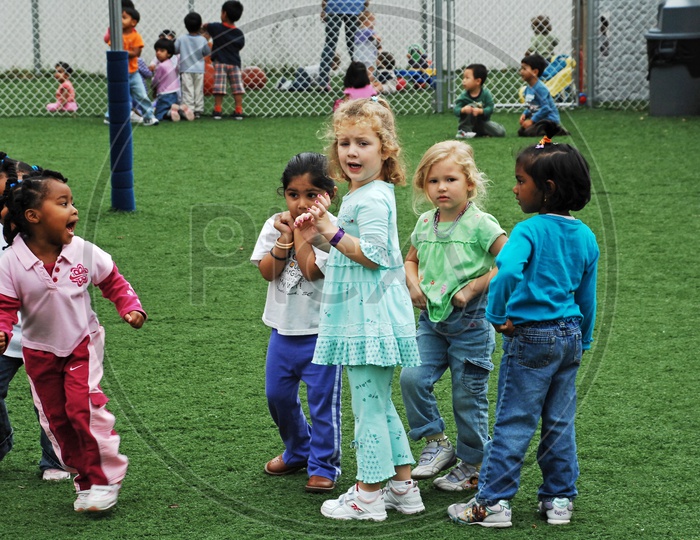Young Cute Kids In Kindergarden or Child Care Center
