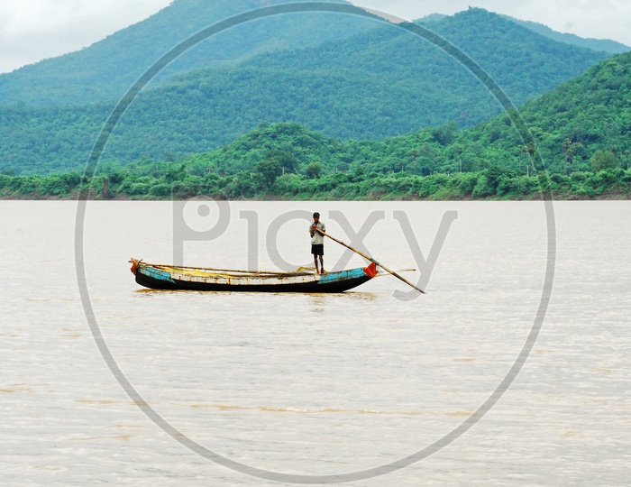 A Rural kid sailing boat on the River Godavari