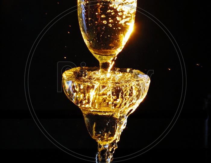 Wine Glass Closeup With Wine Pouring into Glass
