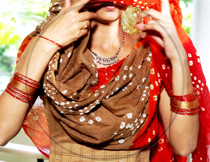Indian woman face covered with scarf