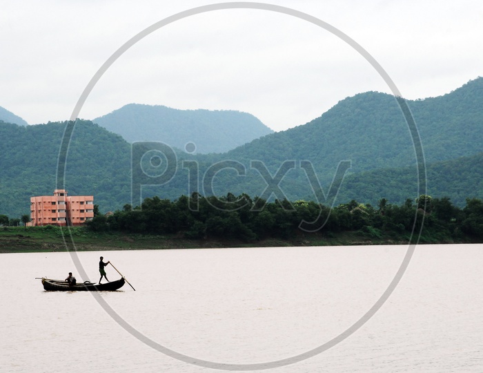 Rural kids sailing boat on the River Godavari