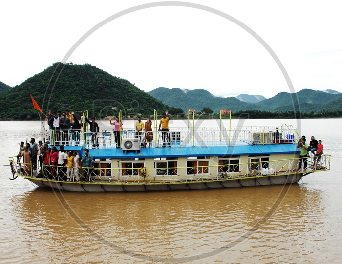 Tourists in the cruise boat moving on the River Godavari