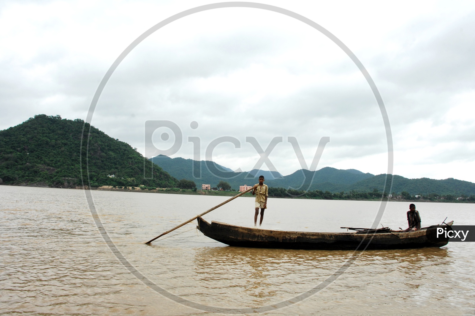 Rural kids sailing boat on the River Godavari