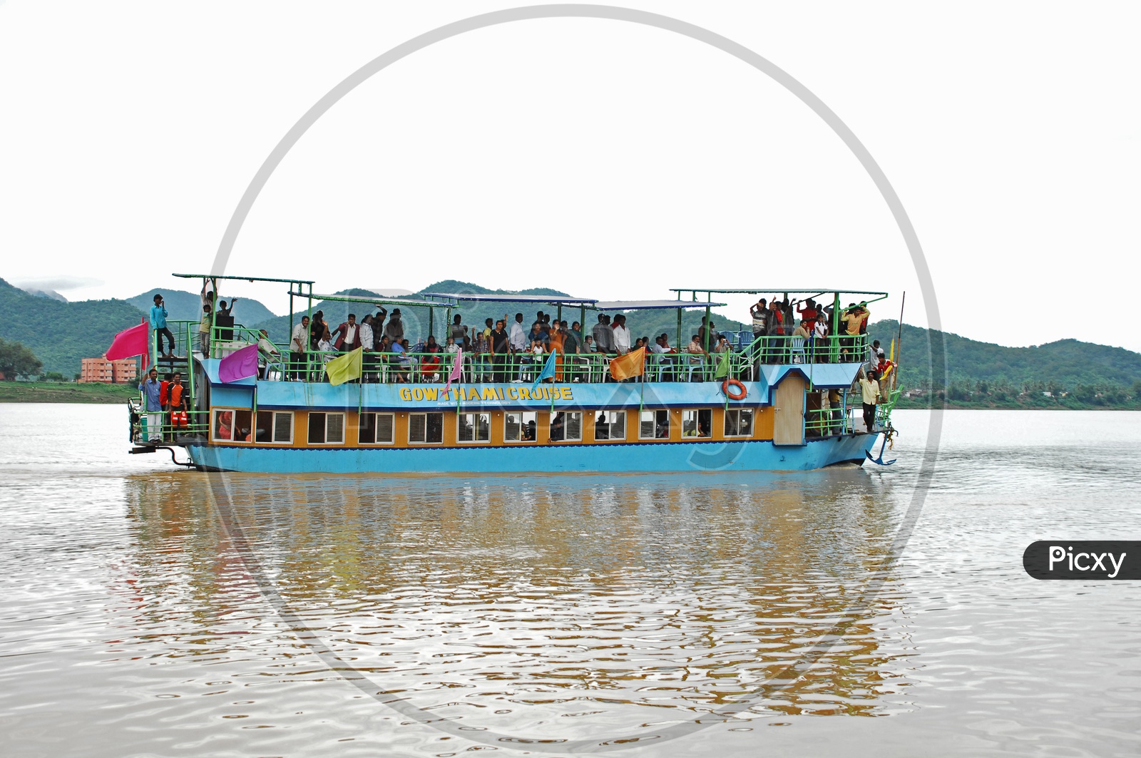 Tourists in the cruise ship moving on the River Godavari