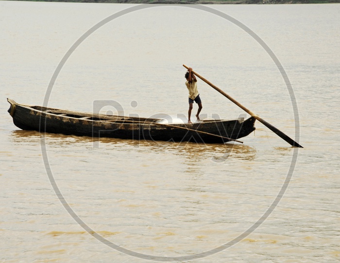 A Rural kid sailing boat on the River Godavari