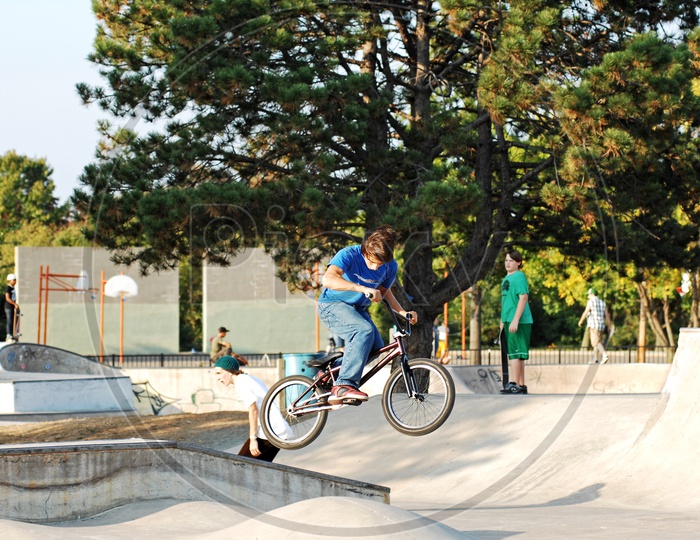 A young boy performing BMX