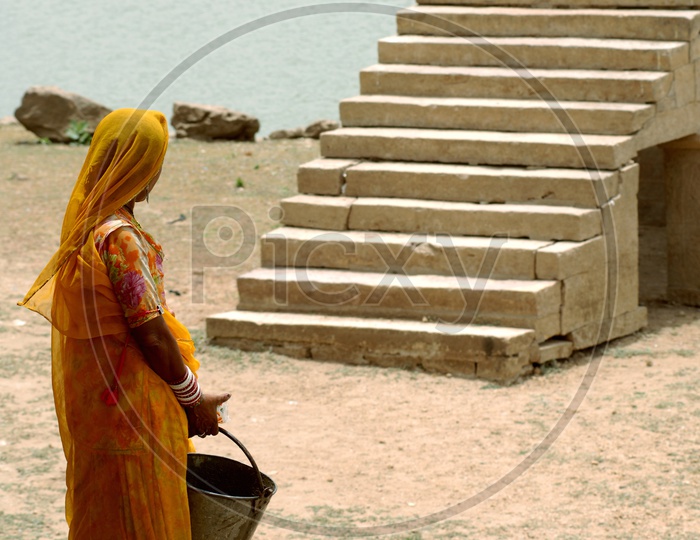 Rajasthani woman carrying a bucket