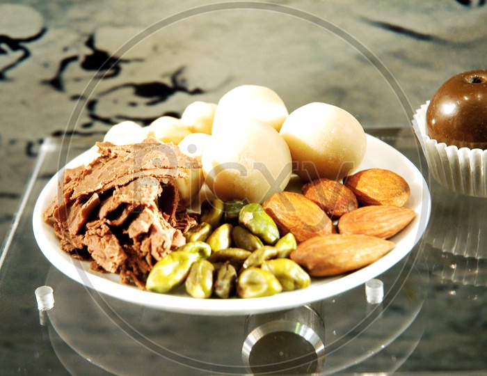 Dry fruits And Nuts in a Plate On a Table