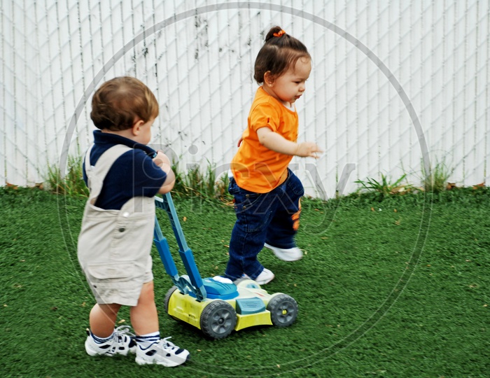 Toddlers playing in the play area