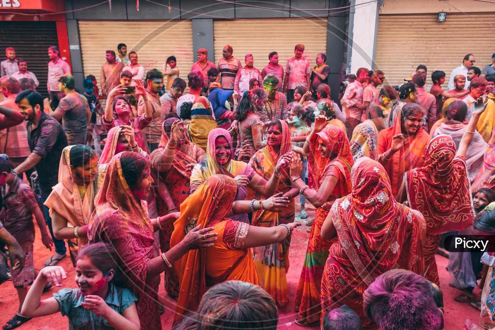 ladies celebrating holi by dancing on traditional songs