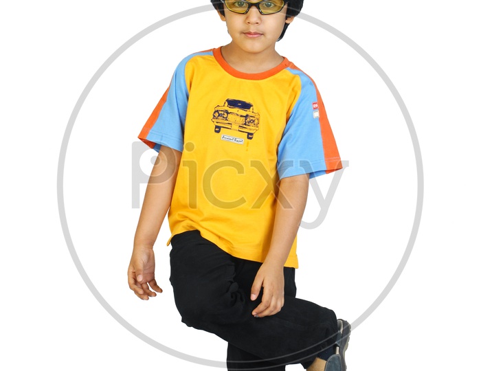 An Indian boy dancing in white background