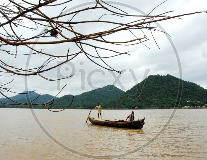 Rural kids sailing the boat on River Godavari