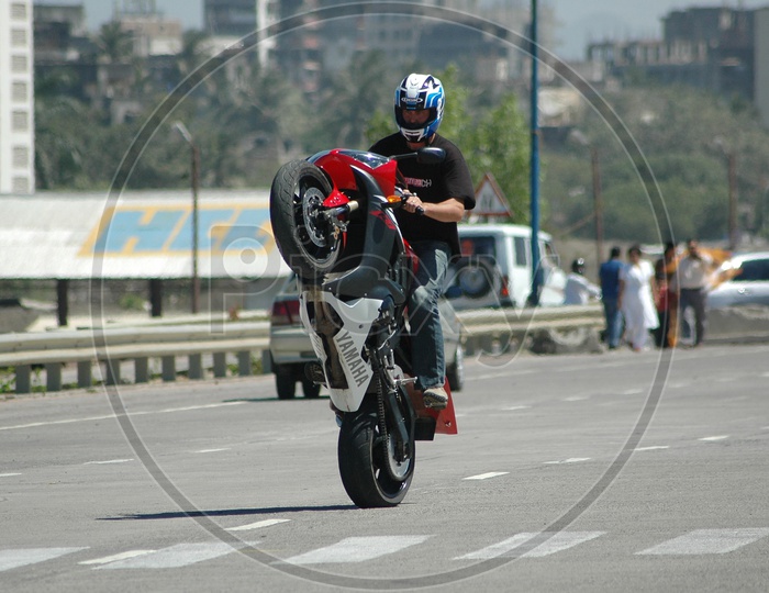 Motorcycle rider performing stunt