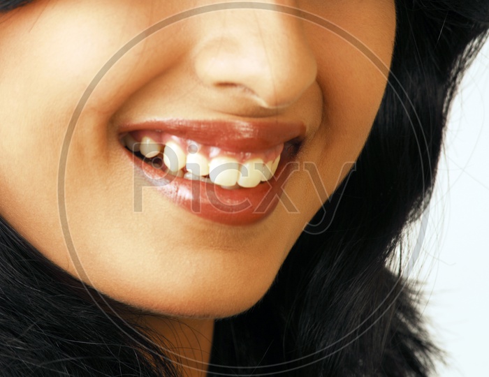 Indian woman smiling wearing lipstick