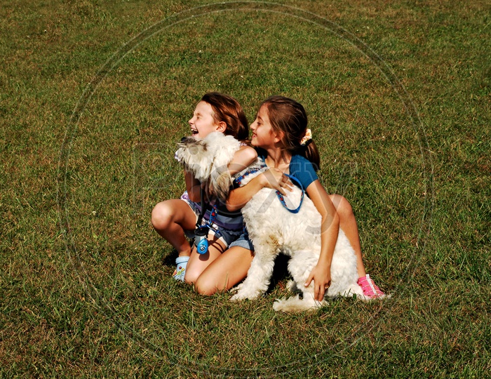 foreign kids playing with a dog