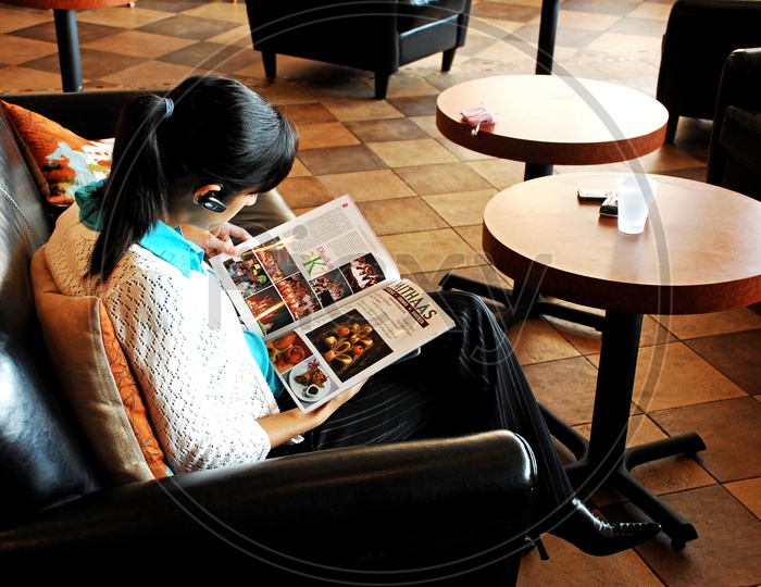 A woman reading a magazine